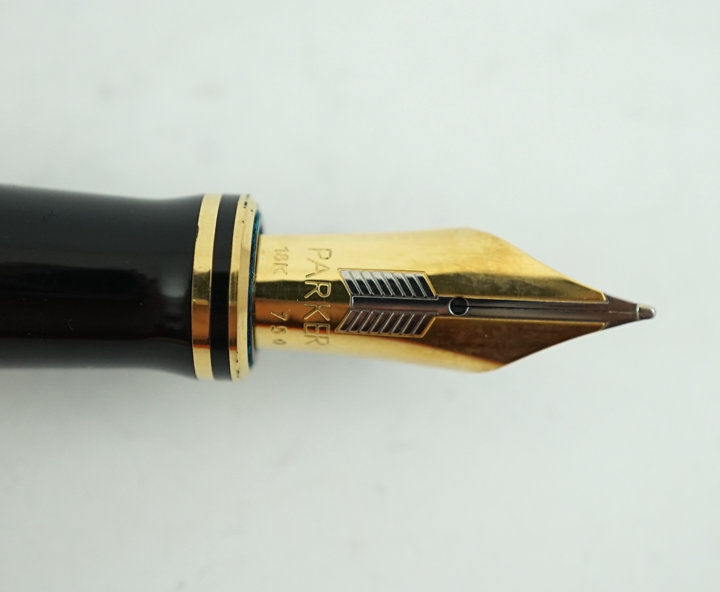 A Parker Duofold orange centennial fountain pen and pencil set, in wooden case